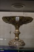 A good embossed silver pedestal tazza with engraved armorial.