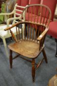 A 19th century ash and elm stick back Windsor armchair.