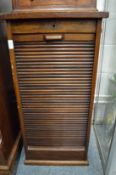 A mahogany tambour fronted filing cabinet (no key).