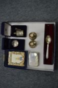 A group of silver items to include cigarette case, a pair of dwarf candlesticks etc.