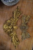 Two gilt wood carvings.