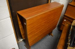 A modern drop flap dining table.