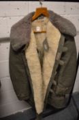 A Russian sheepskin lined canvas military coat.