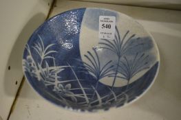 A small Chinese blue and white bowl and a Celadon glazed vase.