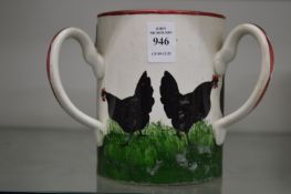 A Wemyss pottery tyg painted with cockerels.