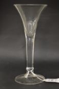 A large plain Georgian glass with tapering bowl.