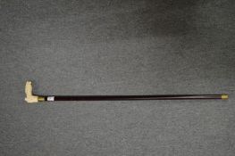 A walking stick, the bone handle carved as a horse and jockey.