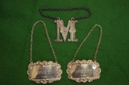 Silver decanter labels.