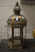 An ornate metal candle lantern.