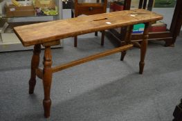 A fruit wood bench seat.