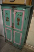 A painted two door cupboard.