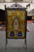A good Victorian stained glass revolving fire screen.