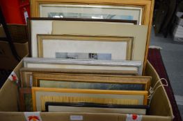 A box of paintings and prints.