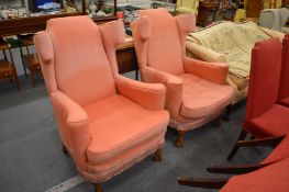 A pair of wing armchairs.
