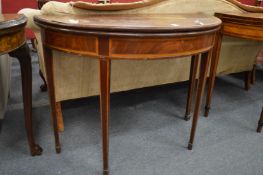 A George III mahogany and satinwood banded fold-over card table.