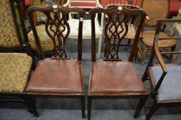 A pair of George III style mahogany dining chairs.