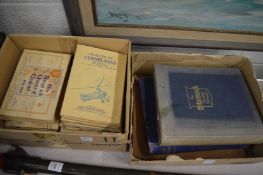 A quantity of cigarette cards in albums and stamps in albums.