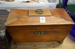 A Victorian mahogany sarcophagus shaped tea caddy.