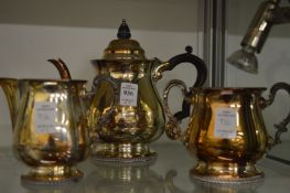 A plated three piece tea service.