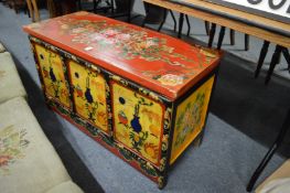 A Chinese decoratively painted storage chest.