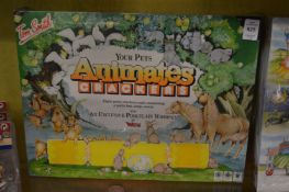 Three unopened Tom Smith novelty crackers containing Wade items.