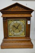 A good architectural oak cased mantel clock.