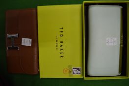 Two leather designer purses, one boxed.