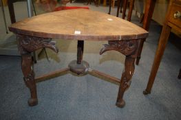 An unusual oak low table on carved legs.