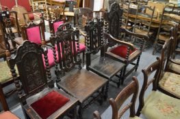 Four various oak dining chairs, one with arms.