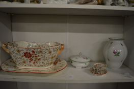 A pottery jardiniere and stand and other decorative items.