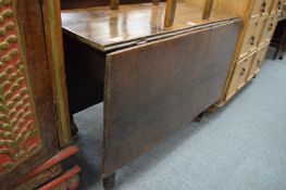 A 19th century oak drop leaf gateleg dining table.