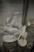German white porcelain model of a rearing horse together with a similar model of two horses.