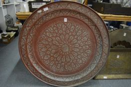 A large Eastern engraved copper charger.