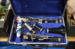 A cased clarinet etc.