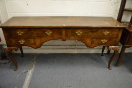 An 18th century walnut dresser with two frieze drawers, two further small drawers on carved cabriole
