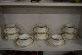 A set of eight Coalport Elite Gold coffee cups and saucers.