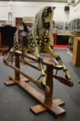 A good large model 21 rocking horse made by G and J Lines, on a pine stand.