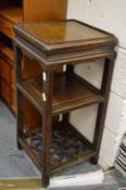 A Chinese hardwood three tier stand.