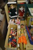 A quantity of puppets and dolls.