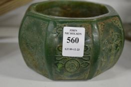 A carved jadeite brush pot.