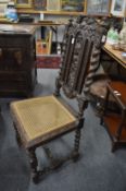 A pair of carved oak high back dining chairs.