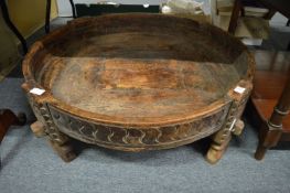 An Eastern carved hardwood circular feeding bowl.