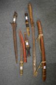 Various Eastern daggers to include a Kris and a Dha sword.