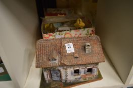 An Elastolin railway cottage and other items.