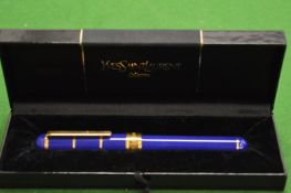 An Yves Saint Laurent fountain pen, boxed.