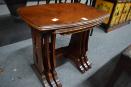 A mahogany nest of tables.