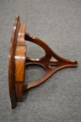A small inlaid mahogany corner shelf.