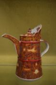 A Chinese red glazed ewer.