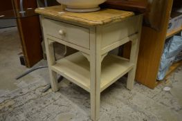 A painted bedside table.