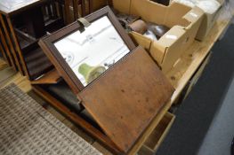 A mahogany campaign mirror.